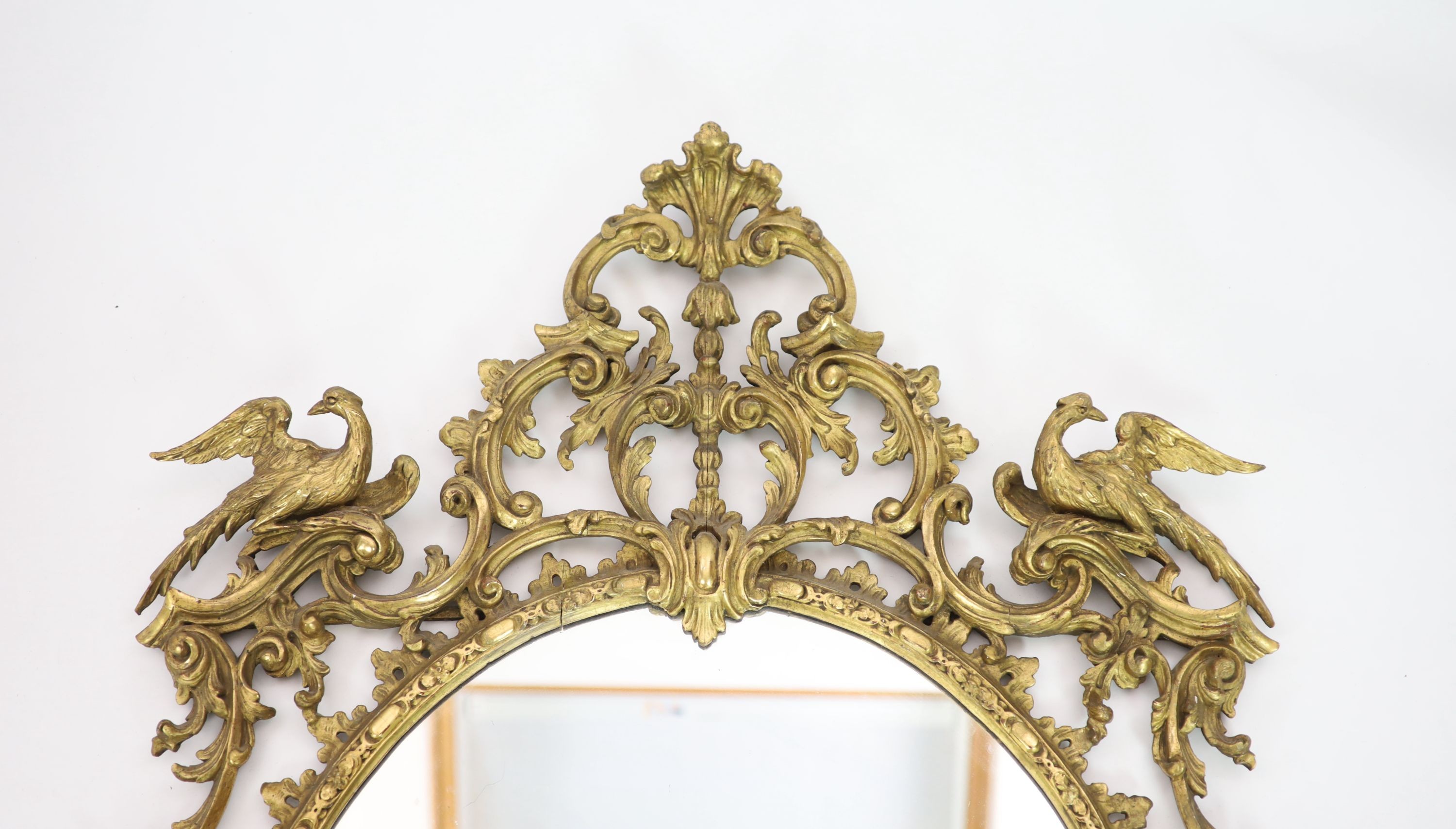 A 19th century Chippendale style gilt and gesso wall mirror W 104cm H 157cm